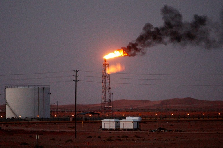 An image showing a gas flame behind pipelines in the desert at Khurais oil field, about 160 km from Riyadh, Kingdom of Saudi Arabia, 23 June 2008 (reissued 14 May 2019). Reports on 14 May 2019 state S