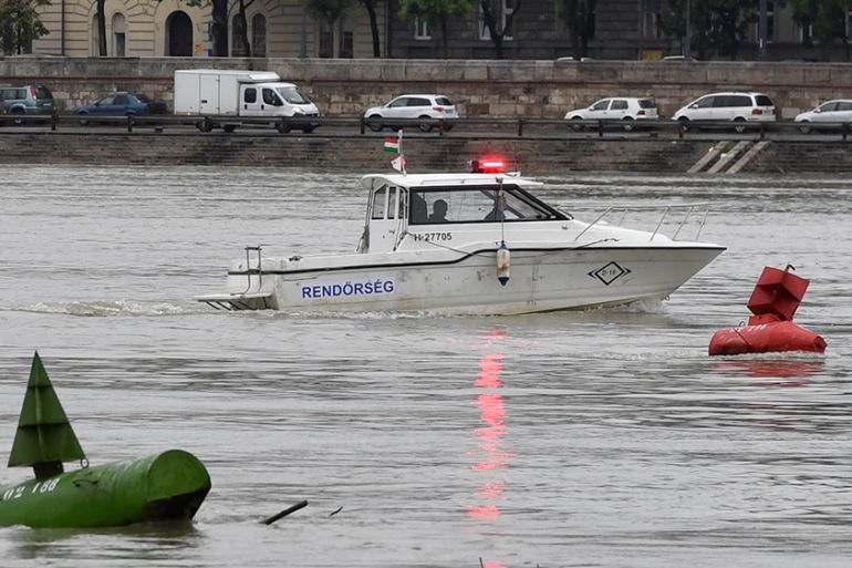 A police boat takes part in the seach operation for survivors on the River Danube in Budapest, Hungary, 30 May 2019, following a collision of the hotelship and a smaller cruise ship on the previous ev