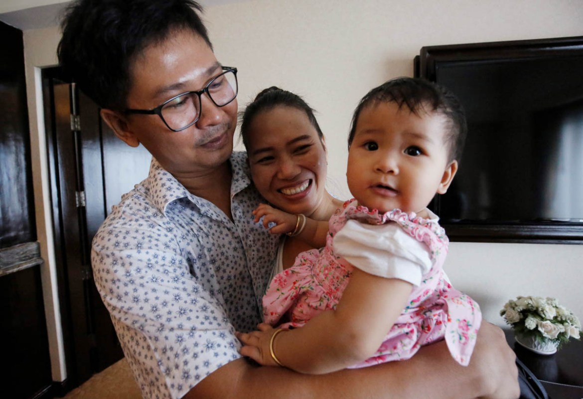 Reuters reporter Wa Lone and his wife Pan Ei Mon celebrate with their daughter after Wa Lone was freed from prison after receiving a presidential pardon in Yangon, Myanmar, May 7, 2019. REUTERS/Ann Wa