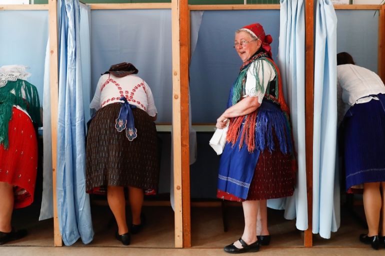 Hungarian women in traditional dress vote in the European parliamentary elections on May 26, 2019 in Veresegyhaz, Hungary. Hungary will vote today to elect the 21 members of the Hungary delegation to