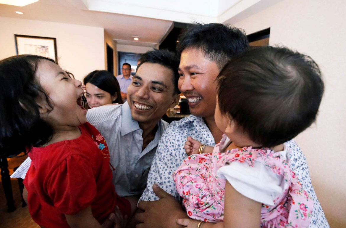 Reuters reporters Wa Lone and Kyaw Soe Oo celebrate with their children after being freed from prison, after receiving a presidential pardon in Yangon, Myanmar, May 7, 2019. REUTERS/Ann Wang/Pool TPX