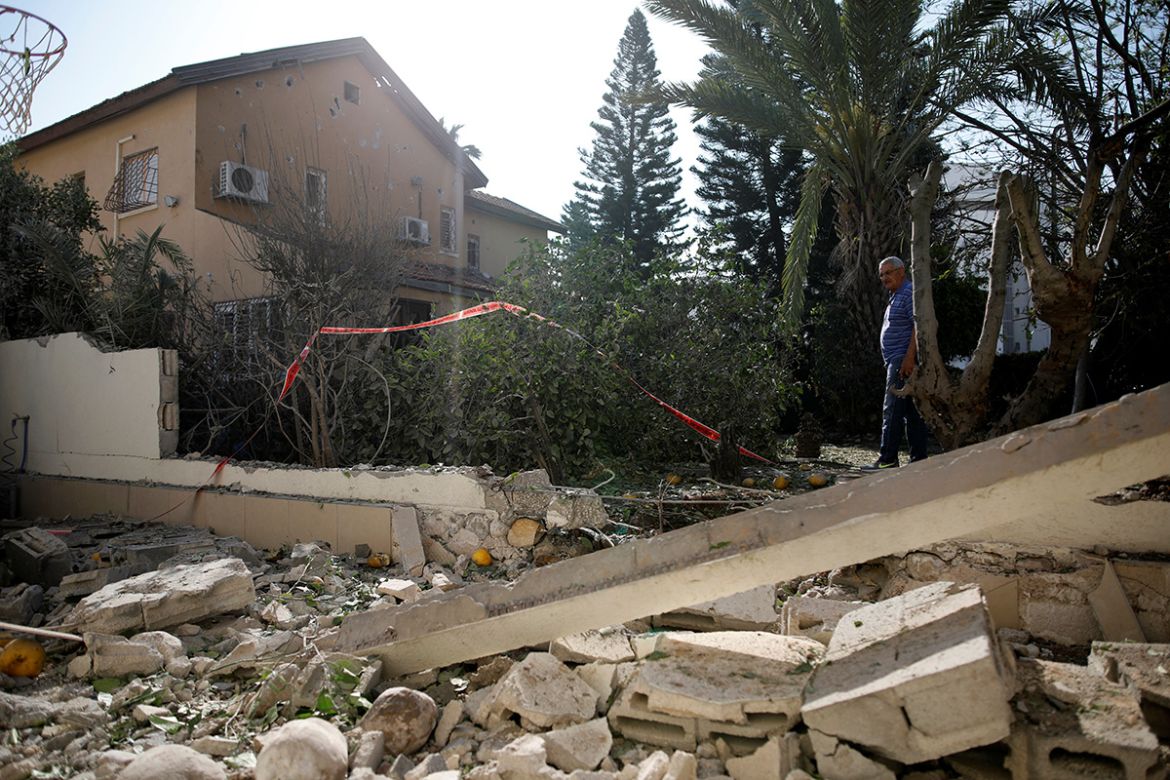 A man walks around a damaged house after it was hit by a rocket fired from Gaza over the border to its Israeli side in Ashkelon Israel May 5, 2019 REUTERS/ Amir Cohen