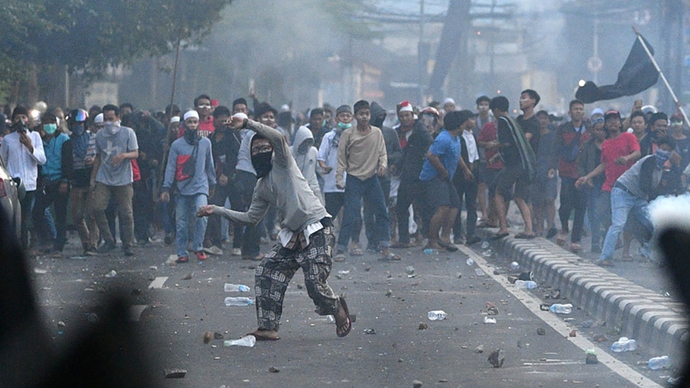 Police clash with protesters in Jakarta, Indonesia