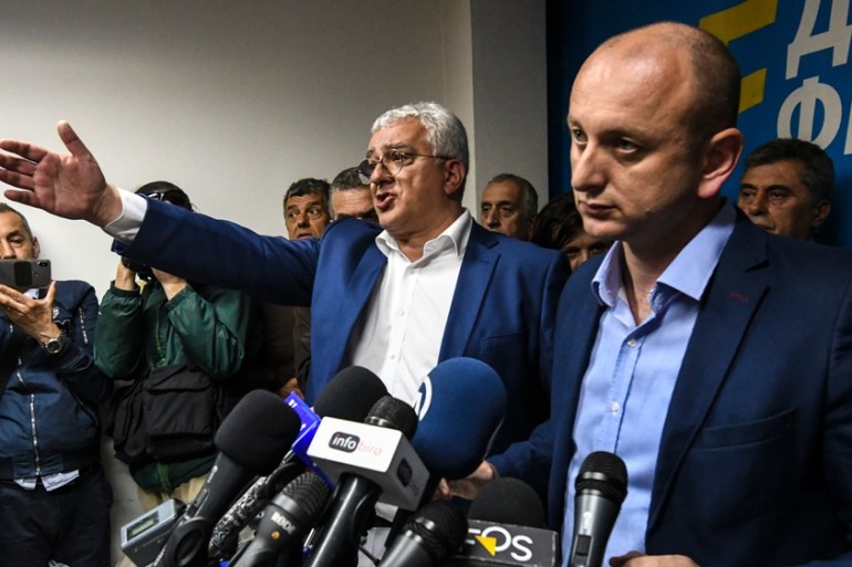 MONTENEGRO-POLITICS-COUP-TRIAL Montenegro opposition leaders Andrija Mandic (C) and Milan Knezevic (R) attend a news conference after being convicted by a Montenegrin court in Podgorica
