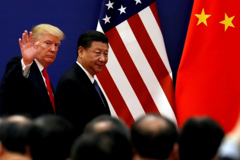 FILE PHOTO: U.S. President Donald Trump and China''s President Xi Jinping meet business leaders at the Great Hall of the People in Beijing