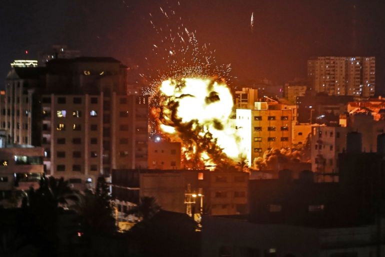 An explosion is pictured among buildings during an Israeli airstike on Gaza City on May 4, 2019.