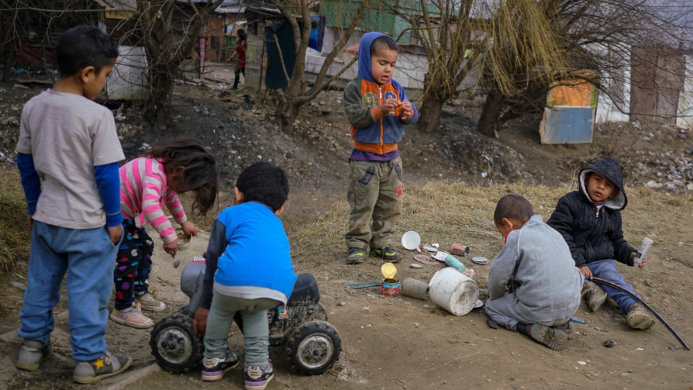 Roma children play in the slum in Jarovnice [Sorin Furcoi/Al Jazeera]