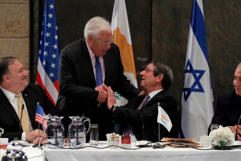Cypriot President Nicos Anastasiades shake hands with U.S. Ambassador to Israel David Friedman next to Israeli Prime Minister Benjamin Netanyahu
