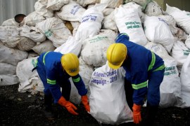 Workers from a recycling company load the garbage collected and brought from Mount Everest in Kathmandu