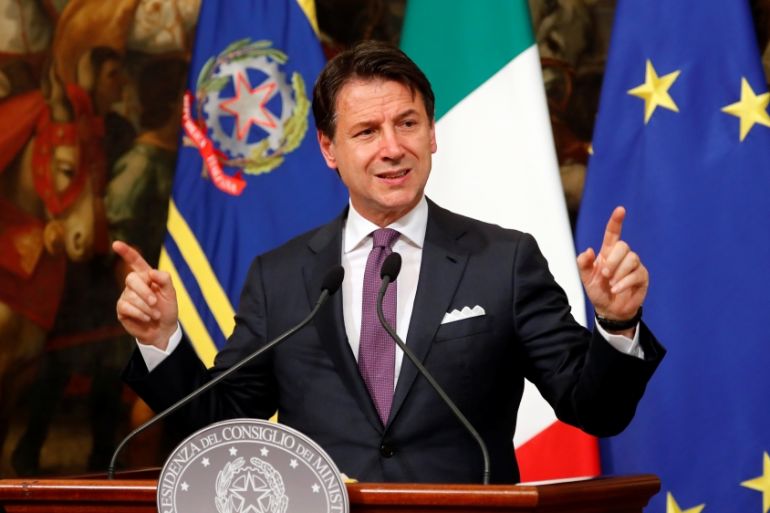 Italian Prime Minister Giuseppe Conte gestures as he attends a news conference at Chigi Palace in Rome