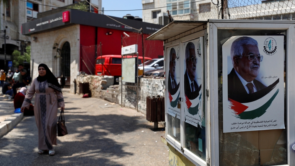 Pictures depicting Palestinian President Mahmoud Abbas are seen in Ramallah, in the Israeli-occupied West Bank June 12, 2019