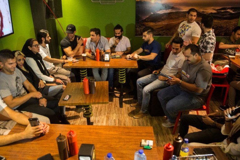 Iranian young people gather at a restaurant in west of Tehran