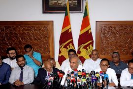 Hakeem, former minister of city planning, water supply and higher education, speaks to media with other muslim ministers after they resigned from their portfolios, in Colombo,