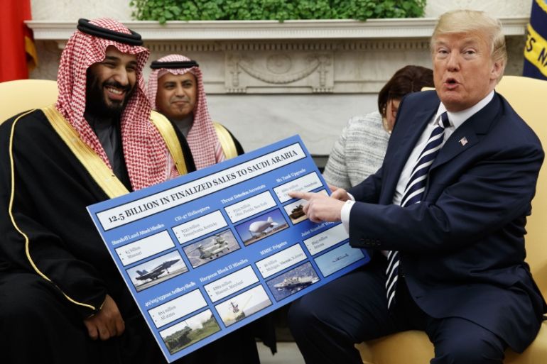 In this March 20, 2018 file photo, President Donald Trump shows a chart highlighting arms sales to Saudi Arabia during a meeting with Saudi Crown Prince Mohammed bin Salman