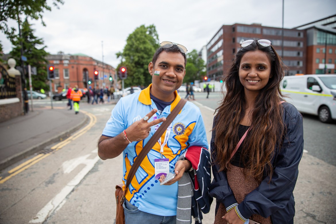 This couple lives in Lagos. Their reason for being in Manchester on Sunday? India-Pakistan World Cup match. [Faras Ghani/Al Jazeera]