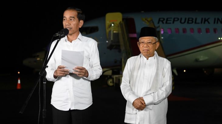 Indonesian incumbent President Joko Widodo delivers a speech as his running mate Ma''ruf Amin listens in Jakarta