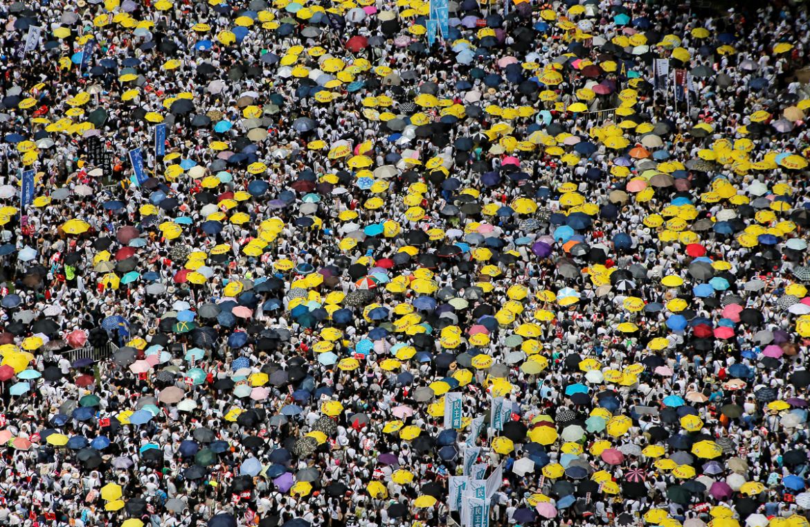 Demonstrators hold yellow umbrellas, the symbol of the Occupy Central movement, during a protest to demand authorities scrap a proposed extradition bill with China, in Hong Kong, China June 9, 2019. R