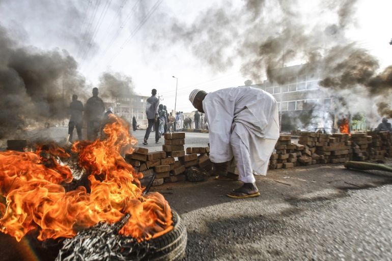 Sudanese protesters close Street 60 with burning tyres and pavers as military forces tried to disperse a sit-in outside Khartoum''s army headquarters on June 3, 2019. At least two people were killed Mo