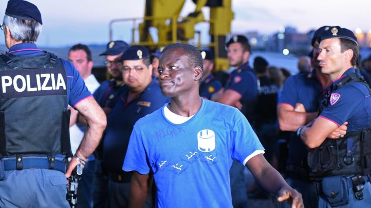 A migrant disembarks from the Sea-Watch 3 rescue ship in Lampedusa