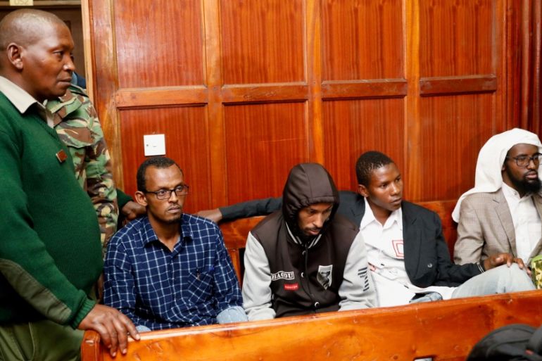 Suspects Hassan Aden Hassan, Mohamed Ali Abdikar, Rashid Charles Mberesero and Sahal Diriye sit in the dock as they wait for the verdict at the Milimani Law Courts in Nairobi