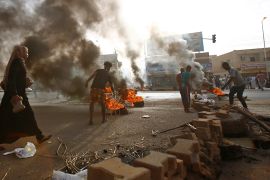 Sudanese protesters block Street 60 with burning tyres and paving stones as military forces tried to disperse the sit-in outside Khartoum''s army headquarters on June 3, 2019. - At least two people wer