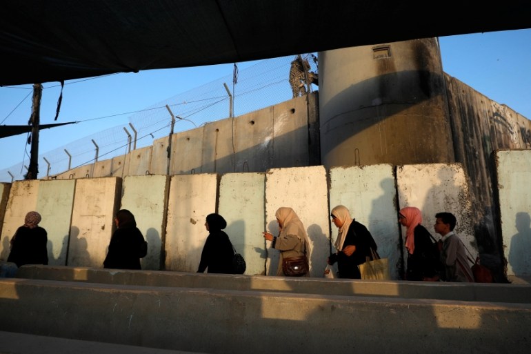 Palestinians make their way to attend last Friday prayer of Ramadan in Jerusalem''s al-Aqsa mosque, at Qalandia checkpoint, in the Israeli-occupied West Bank