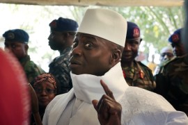 In this December 1, 2016 photo, Gambia's President Yahya Jammeh shows his inked finger before voting in Banjul, Gambia