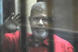 Egypt''s ex-President Morsi dies during trial CAIRO, EGYPT - (ARCHIVE) : A file photo dated August 08, 2015 shows Ousted Egyptian President Mohamed Morsi greeting as he stands inside the defendants''