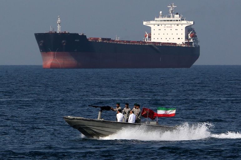 (FILES) In this file photo taken on April 30, 2019, Iranian soldiers take part in the "National Persian Gulf day" in the Strait of Hormuz. - Iran on June 14 dismissed as "baseless" US accusations that