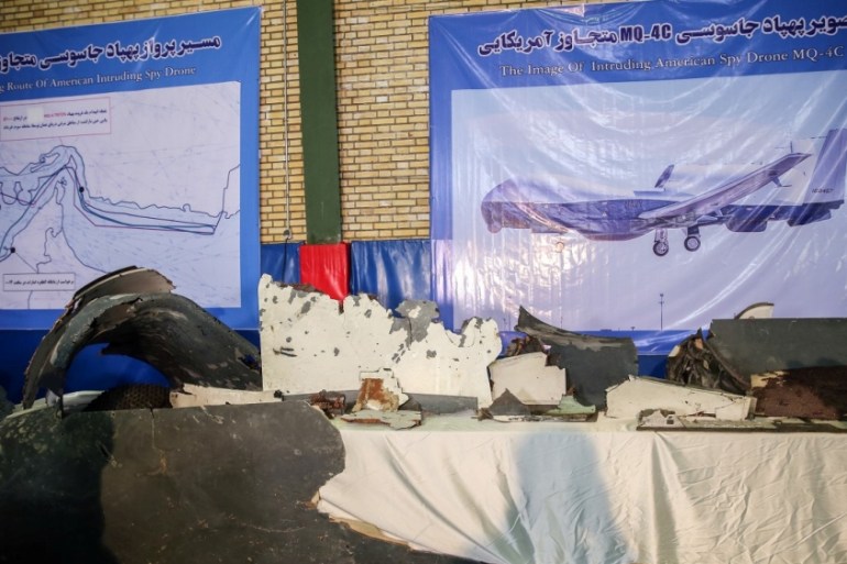 The purported wreckage of the American drone is seen displayed by the Islamic Revolution Guards Corps (IRGC) in Tehran