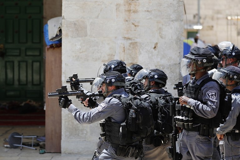 Israeli security forces aim tear gas at Palestinian protesters at the Al-Aqsa Mosque compound, in the Old City of Jerusalem on June 2, 2019, as clashes broke out while Israelis marked Jerusalem Day.