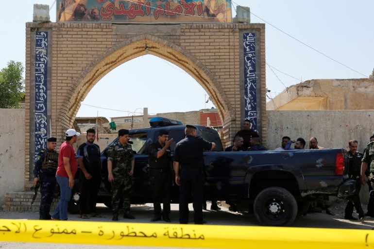 Police tape cordon is seen at the site of a bomb attack at a Shi''ite Muslim mosque in the Baladiyat neighbourhood of Baghdad