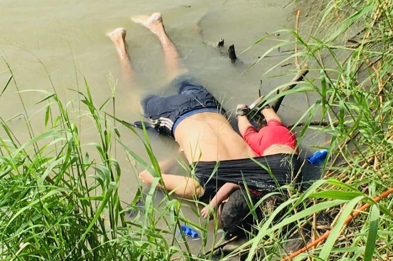 The bodies of Salvadoran migrant Oscar Alberto Martínez Ramírez and his nearly 2-year-old daughter Valeria lie on the bank of the Rio Grande in Matamoros, Mexico, Monday, June 24, 2019, after they dro