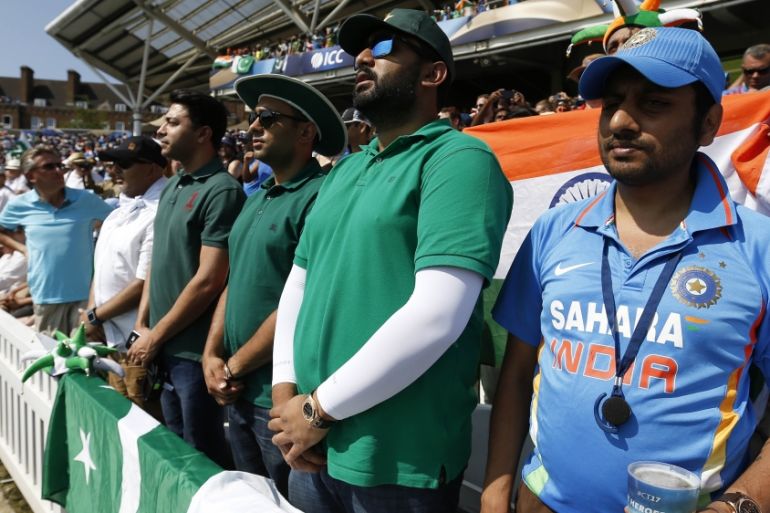Britain Cricket - Pakistan v India - 2017 ICC Champions Trophy Final - The Oval - June 18, 2017 Pakistan fans and India fan during the Pakistan national anthem Action Images via Reuters / Andrew Boyer