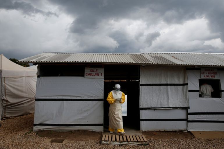 FILE PHOTO: A health worker wearing Ebola protection gear, leaves the dressing room before entering the Biosecure Emergency Care Unit at the ALIMA Ebola treatment centre in Beni