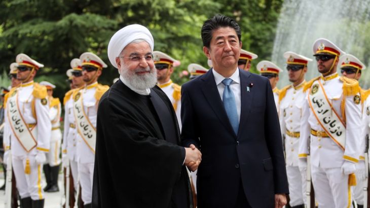 Iranian President Hassan Rouhani shakes hands with Japan''s Prime Minister Shinzo Abe, during a welcome ceremony in Tehran