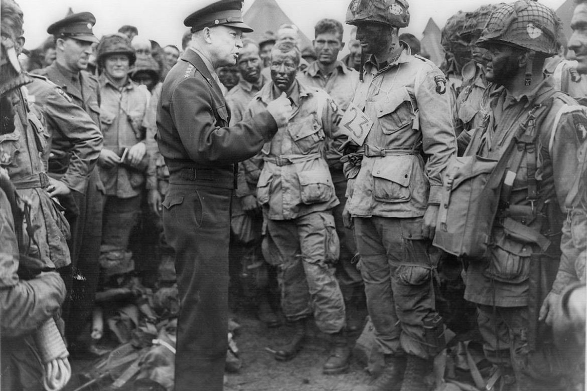 Allied forces Supreme Commander General Dwight D. Eisenhower speaks with U.S. Army paratroopers of Easy Company, 502nd Parachute Infantry Regiment (Strike) of the 101st Airborne Division, at Greenham