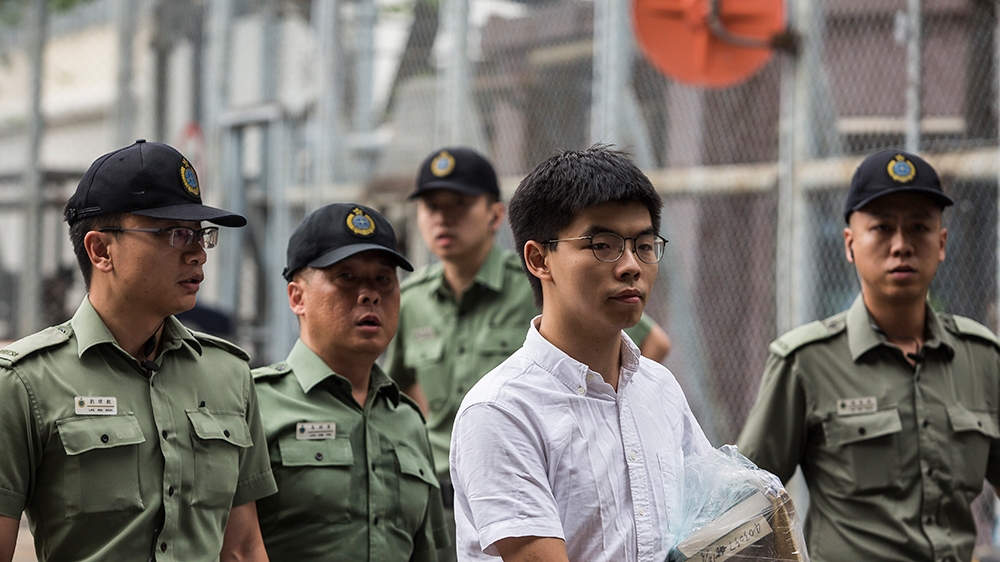 Hong Kong democracy activist Joshua Wong (C) leaves Lai Chi Kok Correctional Institute in Hong Kong on June 17, 2019. - Wong called on the city's pro-Beijing leader Carrie Lam to resign after he walke