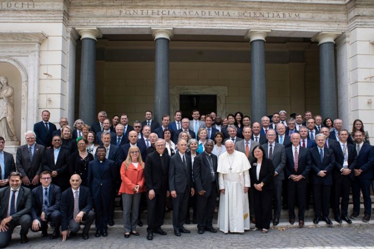 Pope Francis poses for a photograph with energy representatives at the end of a two-day meeting at the Academy of Sciences, at the Vatican