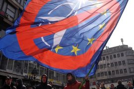 SERBIA-DEMO-NATO A man waves a flag during an Anti-NATO demonstration gathering several hundred people for a protest in downtown Belgrade, on March 27, 2016.