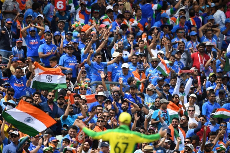 Indian supporters cheer during the 2019 Cricket World Cup group stage match between India and Australia at The Oval in London on June 9, 2019. Dibyangshu SARKAR / AFP