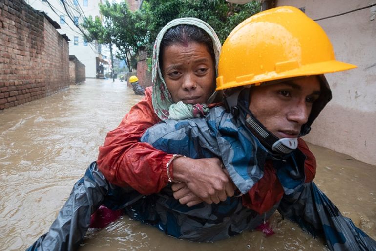 Monsoon rains flood the streets of Kathmandu