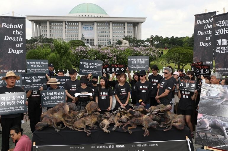 South Korean protesters and American actor Kim Basinger attends a rally against the practice of eating dog meat, in front of the National Assembly in Seoul, South Korea, July 12, 2019. Yonhap via REUT