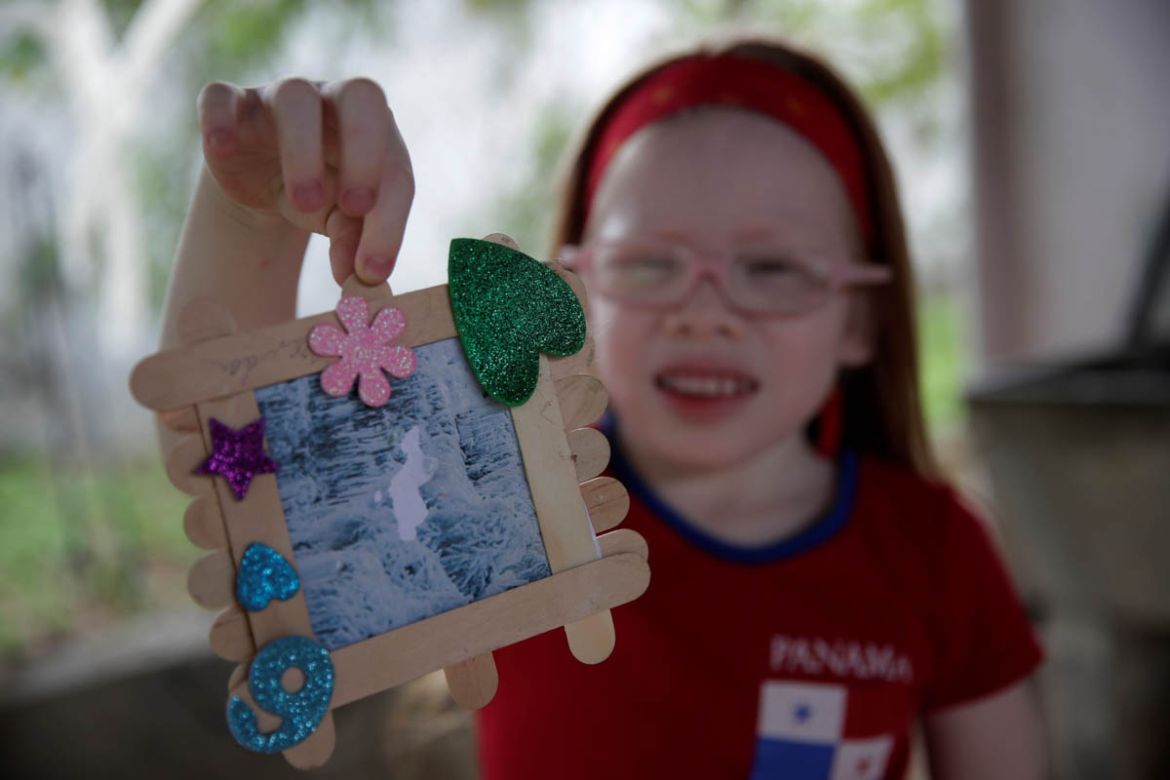 Brenda Hawkins, 6, shows a frame for photos made at school in the Panama Oeste province, Panama, 5 June 2019. The indigenous Guna people, one of seven ethnic groups in Panama, have a population of abo