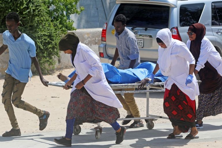 Nurses at the Medina hospital assist a civilian wounded in an explosion outside a hotel near the international airport in Mogadishu