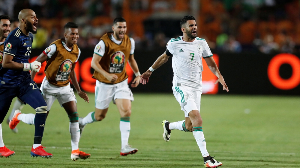Soccer Football - Africa Cup of Nations 2019 - Semi Final - Algeria v Nigeria - Cairo International Stadium, Cairo, Egypt - July 14, 2019 Algeria's Riyad Mahrez celebrates scoring their second goal wi