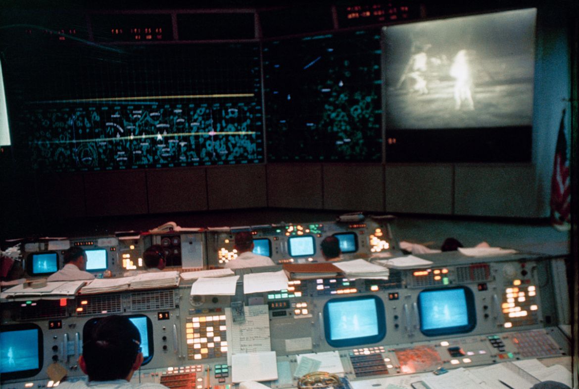 Flight controllers work in the Mission Operations Control Room in the Mission Control Center during the Apollo 11 lunar extravehicular activity on July 20, 1969. [File: NASA/AP Photo]