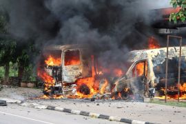 An ambulance and a fire engine set on fire by a Shi''ite group are seen at the Federal Secretariat in Abuja, Nigeria July 22, 2019. REUTERS/Afolabi Sotunde
