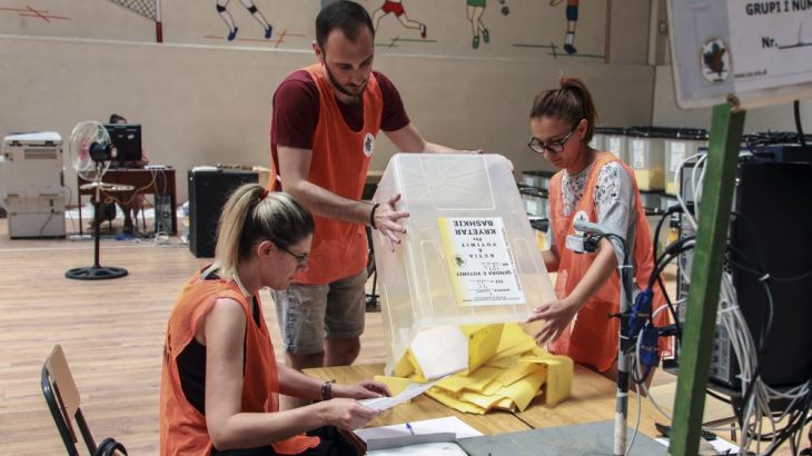 Election officials count the ballot papers at a central counting center in Tirana, Monday, July 1, 2019. Voters cast ballots without disruption Sunday in Albania, where opposition leaders had threaten