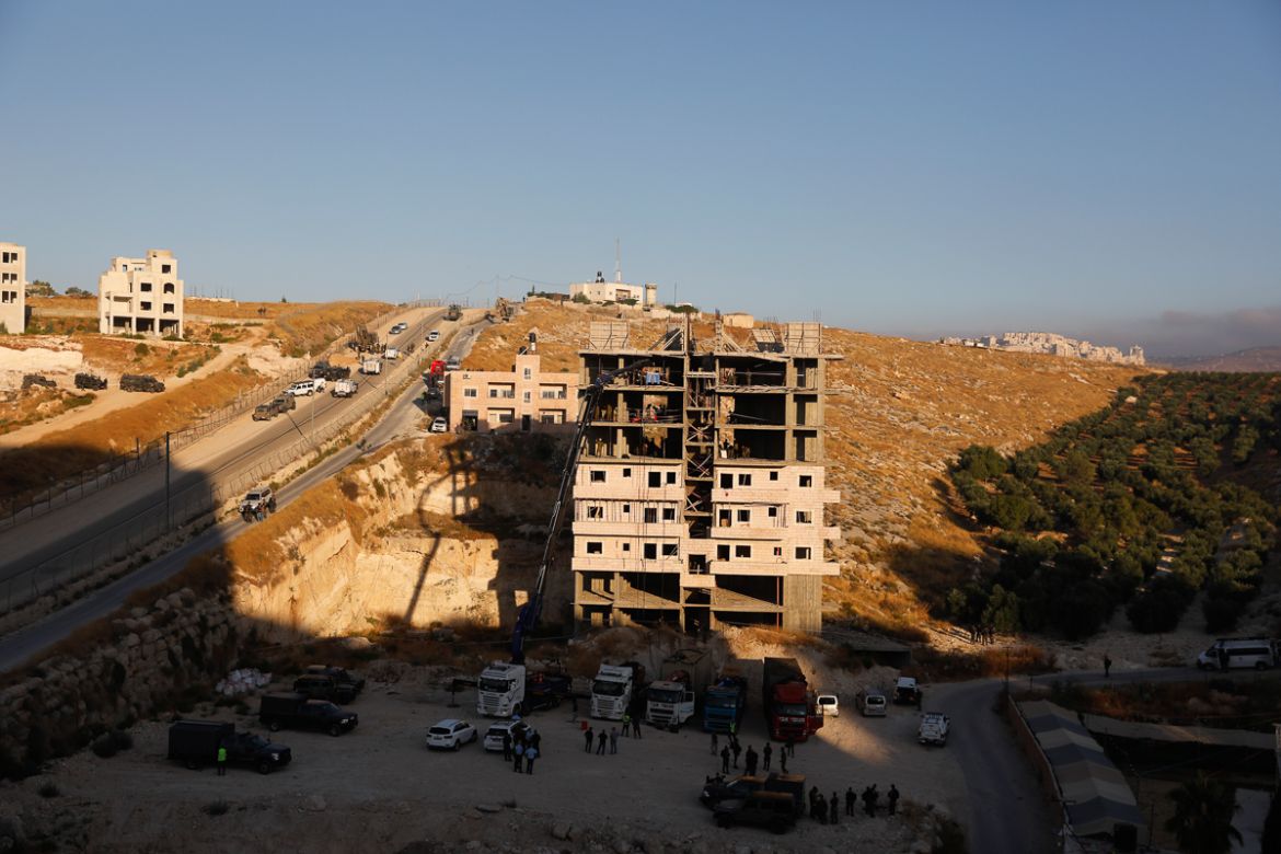 This picture taken on July 22, 2019 shows Israeli security forces preparing to demolish the Palestinian buildings still under construction which have been issued notices to be demolished in the Wadi a